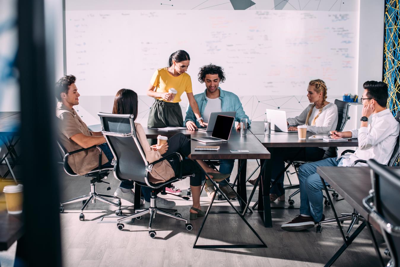People sitting around a table working People sitting around a table working